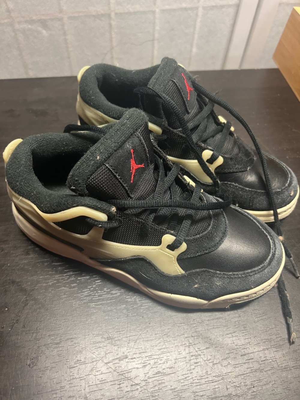 Jordan Kids Black Sneakers with Cream Accents and Red Jumpman